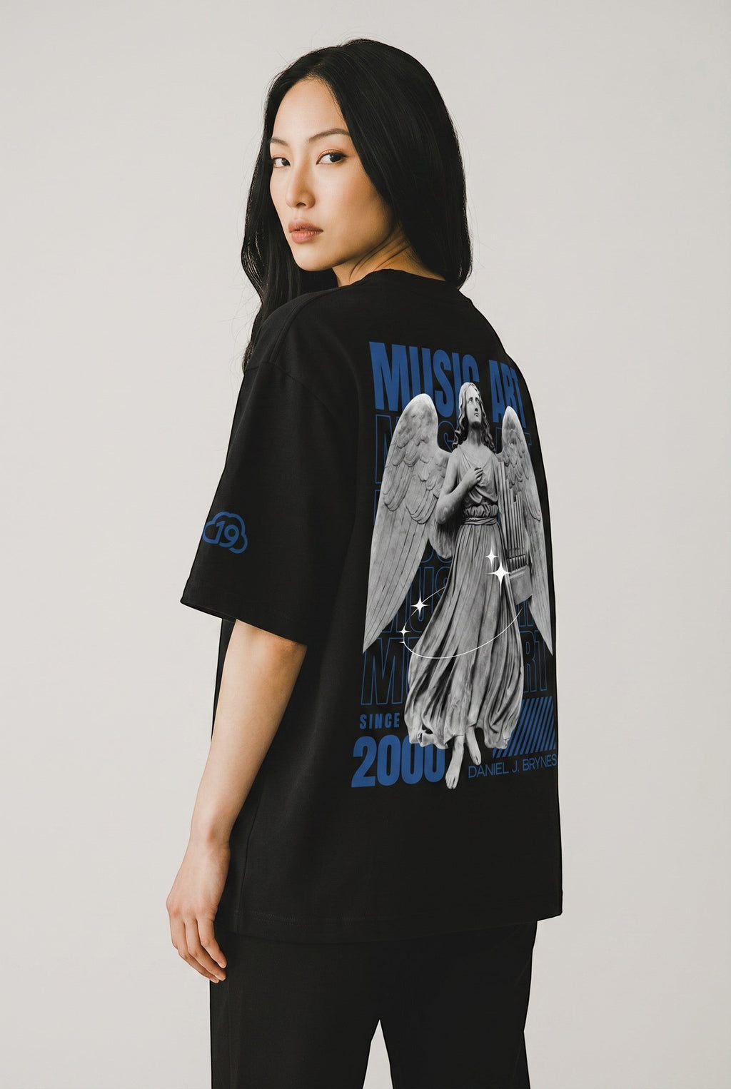 Cloud 19 Official Streetwear Malaysia black oversized 100% cotton t-shirt with angel graphic and blue text.